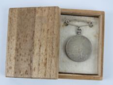 A WWII Japanese medal in box.