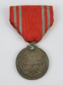 A WWII Japanese Red Cross Medal in box.