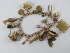 A 9ct gold charm bracelet having heart padlock clasp, hallmarked 375 to clasp and chain,
