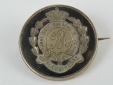 A WWI HM silver and tortoiseshell regimental sweetheart brooch having inlaid emblem for the Royal