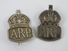 Two HM silver ARP badges, on having pin brooch back, one being a lapel badge,