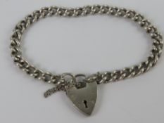 A HM silver curb link chain charm bracel