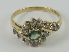 A 9ct gold green amethyst and cz ring,