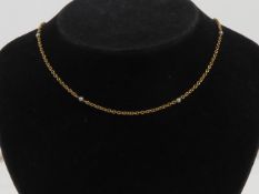A delightful Edwardian seed pearl and yellow metal chain necklace, having barrel clasp,