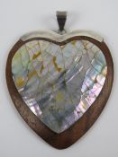 A large silver and abalone shell heart s