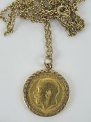 A 22ct gold half sovereign George V 1913 in 9ct gold mount on 9ct gold chain necklace,