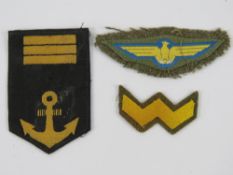 Three WWII Japanese cloth badges, includ