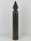 An inert WWII Russian T34 76mm shell, dated 1943. 54cm high.