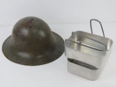 A WWII British Zucherman helmet, no liner, dated 1941. Together with a mess tin.