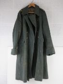 A WWII Swiss Army Great Coat, stamped and dated with regimental shoulder insignia.