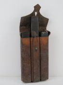 A WWII German MP34 leather magazine pouch containing three MP34 magazines.