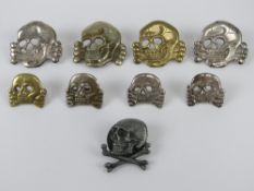 A quantity of assorted reenactors Totenkopf 'Deaths Head' badges including one marked RZM 215/41 SS