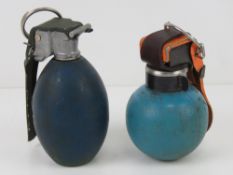 An inert British Army L111 training grenade. Together with an inert L56A1 training grenade.