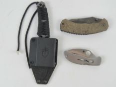 Two pocket knives being Spyderco and Fox knives. Together with a Gerber knife in sheath.
