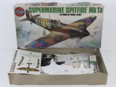 A vintage Airfix Supermarine Spitfire Mk1a, 1/24 scale model kit.