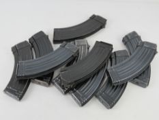 A quantity AK 7.62 magazines. Ten items.