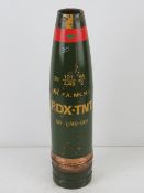 An inert 105mm RDX-TNT projectile, dated 1949. Standing 48cm high.