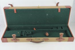 A canvas and leather 'Guardian' gun case having combination lock,