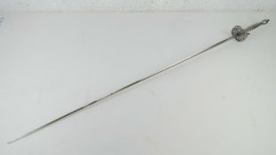 A Court sword having cut steel type guard with faceted pattern to grip and 87.5cm triform blade.