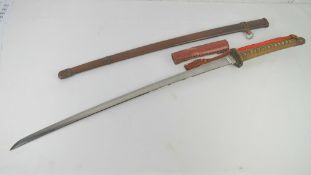 A WWII Japanese NCO's sword having wrapped shagreen handle with outer leather covering.