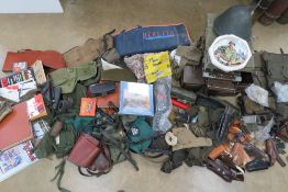 A quantity of assorted militaria inc German dot camo shirt, US shirt, PSL scope lenses, gun cases,