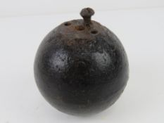 An inert WWI British No.15 'cricket ball' grenade.