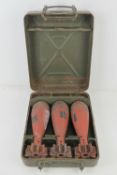 A WWII German 80mm mortar case having three inert mortars with fuses within.