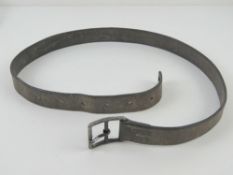 A WWII German or Russian brown leather belt. No legible markings upon.