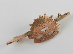 A 9ct rose gold Australian Commonwealth Military Forces brooch / badge. 1.5g.
