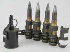 An inert RG42 grenade together with four 20mm cannon rounds in link.
