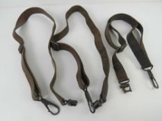 Three MG34 leather slings with fittings at both ends of each sling.