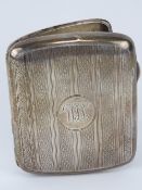 A HM silver cigarette case having engine turned engraving throughout, gilded interior,