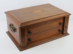 A mahogany cutlery box cross banded with walnut opening to reveal (empty) baize lined cutlery
