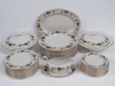A twelve piece setting of Royal Doulton Larchmont dinnerware comprising dinner plates, large plates,