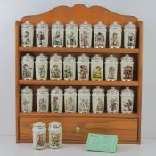A set of Hummel herbs and spices jars on wooden rack, together with salt and pepper cellar set.