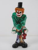 A Murano-style art glass clown figurine standing 26cm high.
