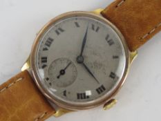 A vintage 9ct gold manual wristwatch having silvered dial with subsidiary seconds dial and blue