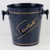 A Nicolas Feuillatte champagne ice bucket, blue and gilt paint, 20.5cm high.