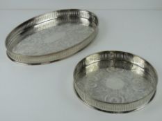 A large oval silver plated tray, 38cm wide, with matching smaller circular silver plated tray, 24.