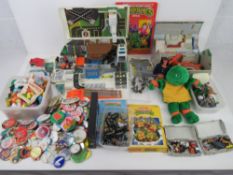 A quantity of assorted vintage toys including micro machines, Teenage Mutant Ninja Turtles, badges,
