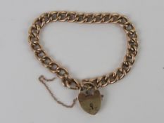 A 9ct rose gold charm bracelet having fine sprung release heart padlock clasp,