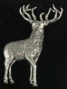 A pewter brooch in the form of a stag by AB Brown, in presentation box.
