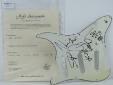 A guitar pick guard/scratch plate autographed by Coldplay, complete with J G Autographs certificate,