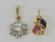 A 14ct gold pendant of floral form set with ruby, sapphire and diamond, 1.