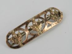 A Scottish thistle themed hair clip, stamped verso W&S 9ct Sil, 5cm in length.