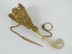 A Victorian Tussie Mussie (Tussy Mussy) posy holder having carved mother of pearl handle and a gilt