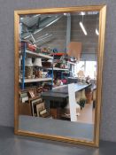 A contemporary rectangle bevel edged mirror in gilt frame 68 x 98.