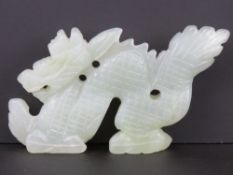 A carved celadon jade figure of a dragon, approx 11.5cm in length, 6.5cm high, 1.3cm wide, 127.5g.