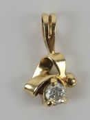 A diamond pendant, unmarked yellow metal, the round cut brilliant diamond approx 0.