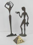 A pair of Greek figurines being male and female standing 25 and 31cm high respectively,